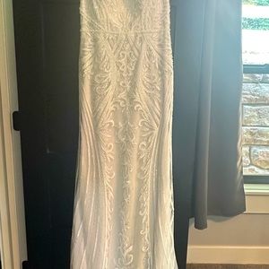 Wedding dress by Maggie Sottero Designs.